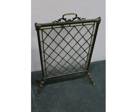 Edwardian brass and leaded glass firescreen, with pierced carrying handle, diamond patterned lead glass, raised on out-splaye