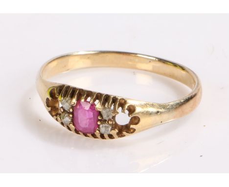 Gold coloured metal ring set with central ruby flanked by four diamond chips, ring size P, 2g