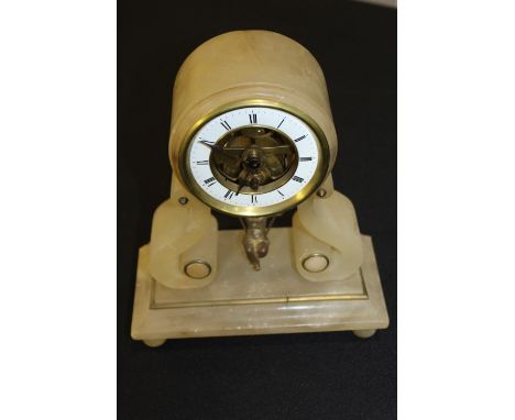 Edwardian swinging cherub mantle clock, the onyx clock with a white enamel chapter ring above arched supports 