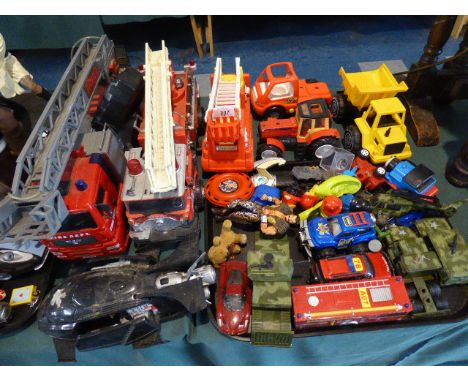A Collection of Various Plastic and Diecast Toys to Include Fire Engines, Tractors, Army Vehicles Etc 