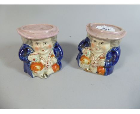 A Pair of 19th Century Ceramic Sash Window Stops in the Form of Seated Toby 