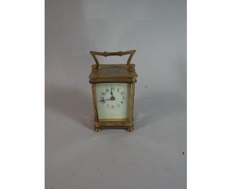 A French Brass Carriage Clock with White Enamel Dial and Blue Arabic Numbers, 15cm High