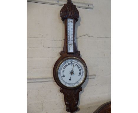 A Late Victorian Oak Onion Topped Wheel Barometer with White Enamel Dial and Temperature Scale, 83cm high 