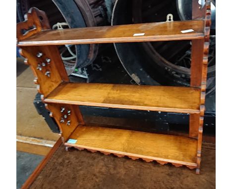 A late Victorian oak Gothic Revival wall shelf, 60cm high, 58cm wide, 15cm deep