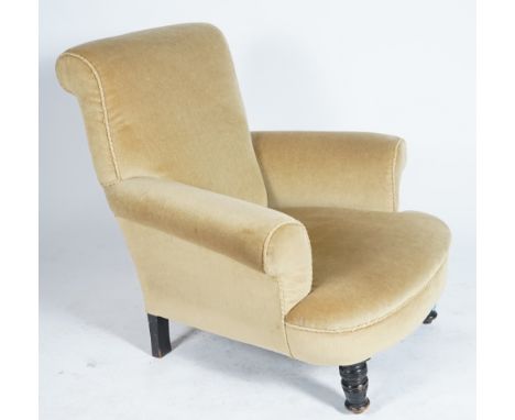 A VICTORIAN EBONIZED LOW ARMCHAIROn ring turned supports 90cm wide; 86cm high