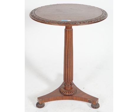 A REGENCY MAHOGANY CIRCULAR OCCASIONAL TABLE, ON MELON FEET50cm diameter; 70cm highMultiple chips and missing sections of ven