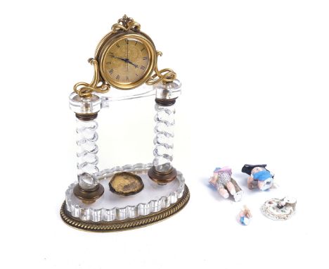 A VICTORIAN GILT METAL AND GLASS MANTEL TIMEPIECE (A.F)condition; the central ceramic figure damaged and in multiple pieces.&