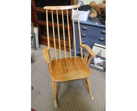 An Ercol design stick back rocking armchair