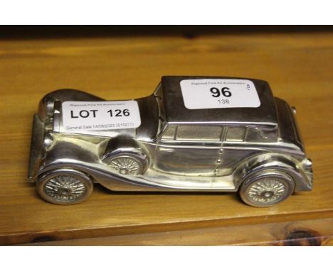 A silver plated model/moneybox example of a Rolls Royce