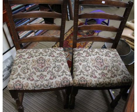 A set of six tapestry seated bar back dining chairs