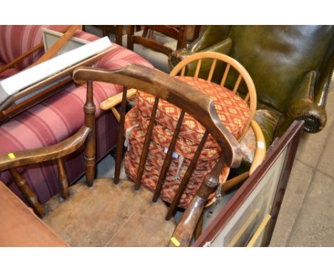 An light Ercol stick back elbow chair; and an early 20th Century beech and elm stick back elbow chair