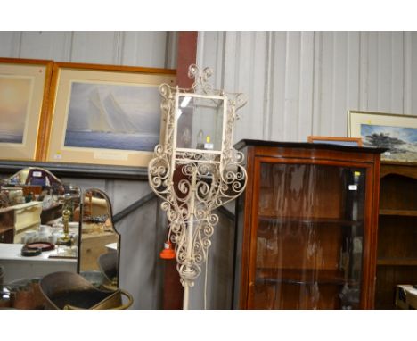A decorative wrought metal standard lamp
