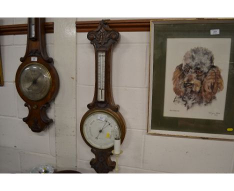 A walnut cased barometer by E &amp; A Butterfield of Bradford 