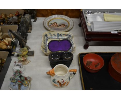 A 19th Century continental porcelain cabinet plate depicting cherubs; a Meissen patterned shallow dish; a pair of cased opera