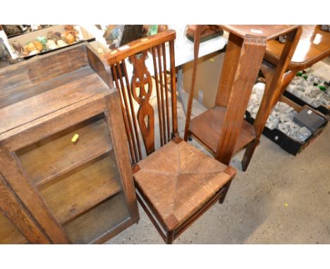 An elm and beech stick back nursing chair with rush seat