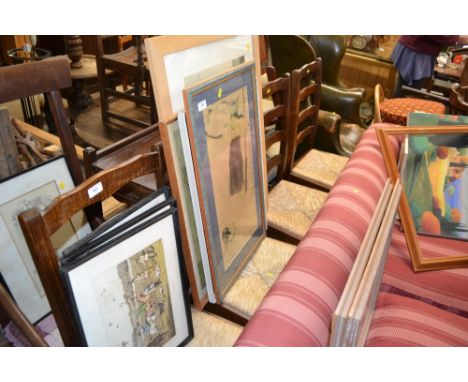 A set of four oak ladder back dining chairs with rush seats