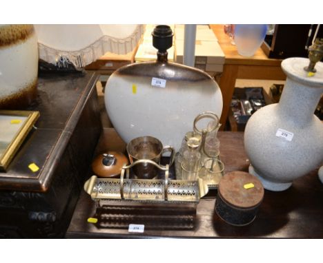 A large pottery table lamp, plated cruet, table lighter etc. 