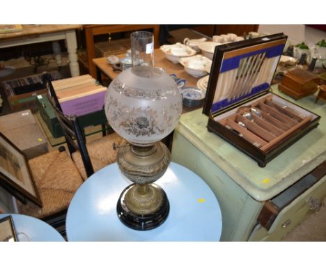 A Victorian brass oil lamp with etched glass shade 