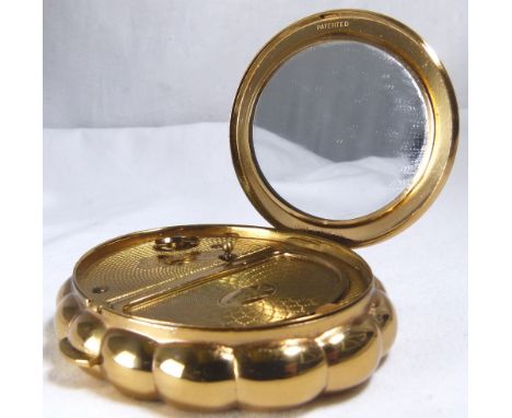 KIGU MUSICAL POWDER COMPACT. Kigu gold plated musical powder compact in working order CONDITION REPORT: The item is in good c