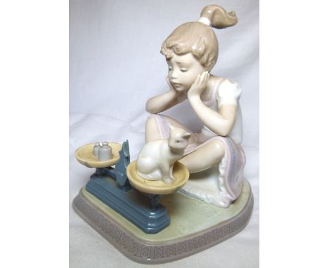 LLADRO GIRL FIGURE. Lladro seated girl with scales, in original box, H: 18 cm