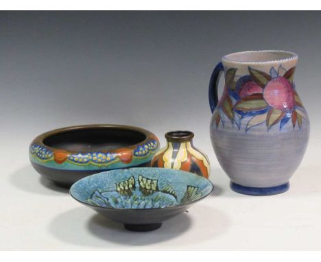 A Charlotte Rhead jug, a Gouda vase, a Gouda bowl and a studio pottery bowl decorated with a fish (4)