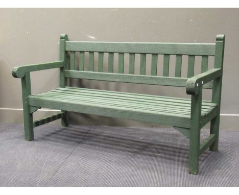 A three seater green painted garden bench 154cm wideProvenance:Landwade Hall, Exning, Suffolk