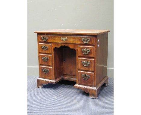 An 18th century walnut kneehole desk 73 x 81 x 48cmCondition report: General knocks and ware consistent with age and use. Cra