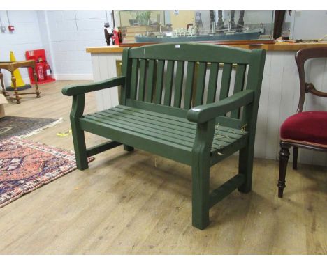 A green painted garden bench 94 x 123 x 62cmProvenance:Landwade Hall, Exning, Suffolk