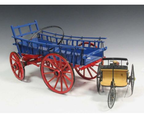 A wooden model of a cart and a miniature model of a triycleProvenance:Landwade Hall, Exning, SuffolkCondition report: Cart me