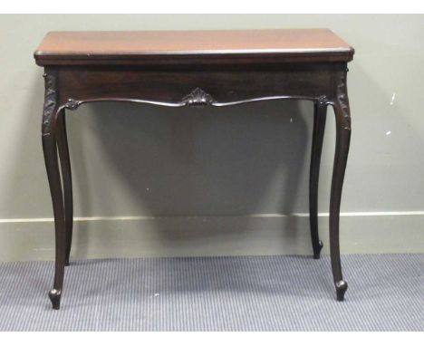 A late Victorian mahogany fold over swivel top card table with moulded frieze on carved cabriole legs 76 x 90 x 49cm