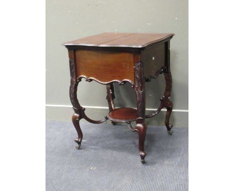 An Edwardian mahogany drinks table, the folding top opening to reveal a pop-up drinks tray, 78 x 59 x 58 cm (closed)Outside i