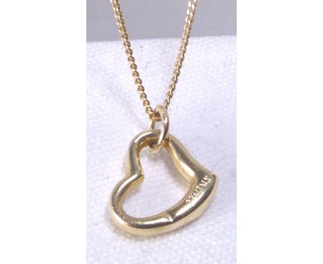 9 CT HEART PENDANT. 9 ct gold heart pendant on 9 ct gold curb chain