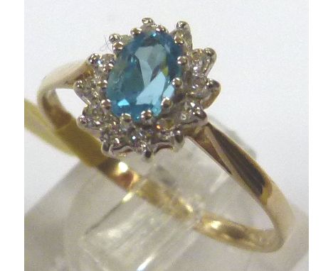 9 CT CLUSTER RING. 9 ct gold blue topaz and CZ cluster ring, size R