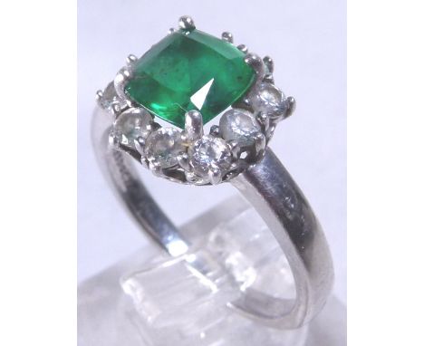 SILVER RING. Silver green and white stone set ring, size R