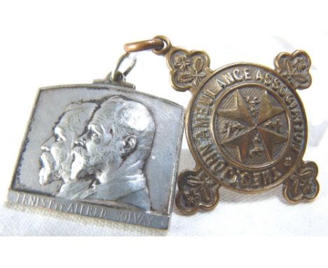 TWO ALBERT FOBS. Two Albert fobs, a white metal ICI item and a St Johns Ambulance example 
