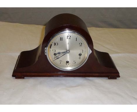 A mahogany mantle clock