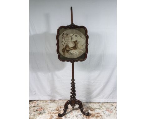 A Victorian rosewood pole screen with tapestry.