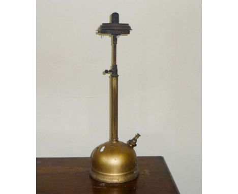 A vintage brass paraffin lamp