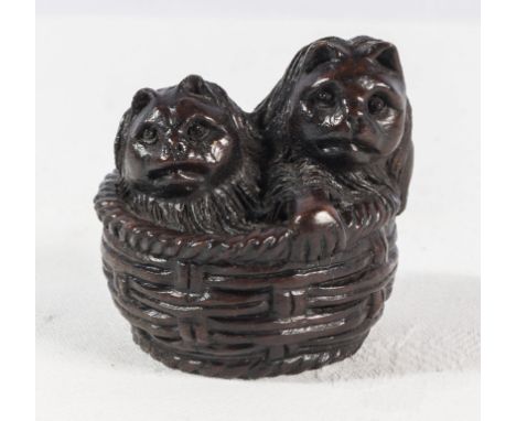 A Japanese netsuke Cat and kittens in a basket, signed