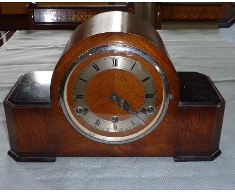 An oak mantle clock