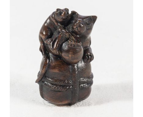 A Japanese netsuke two rats on a sack, signed