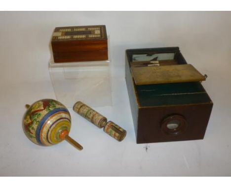 A box viewer, paper covered wood construction, 10" long, with six colour printed wood framed views of Paris, a mahogany and i