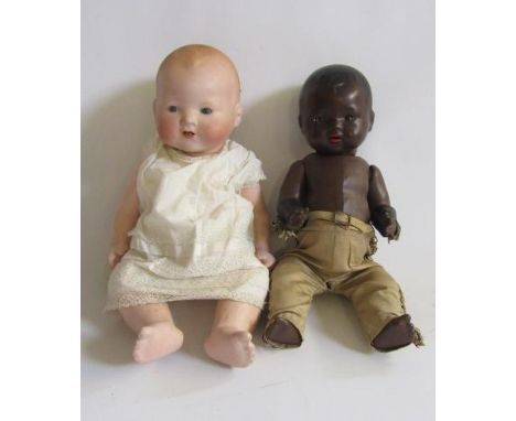 An Armand Marseille bisque head baby doll with blue glass sleeping eyes, open mouth and teeth, moulded hair, composition bent