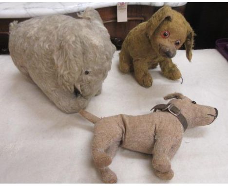 A pre-war Chad Valley terrier, originally dark gold plush (now very worn), with probably original collar, labelled, 8" high, 
