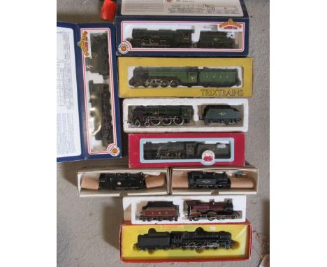 Nine steam locomotives by Bachmann, Hornby, Wrenn and Trix comprising 0-6-0 B.R. tank, Flying Scotsman, B.R. Evening Star, L.