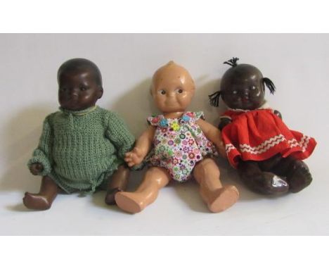 An Armand Marseille bisque head black baby doll with brown glass sleeping eyes, closed mouth, moulded hair, composition bent 
