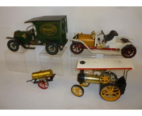 Three Mamod live steam models, Delivery Van, Tourer and Traction Engine, and a two wheel Bowser, some parts missing, no boxes