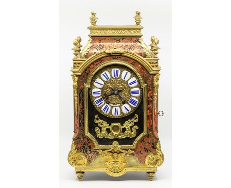 Dutch Tortoise Shell Mantel Clock with brass inlays enamel numerals Movement chiming on a gong. By H.A Kloosterhuis Amsterdam