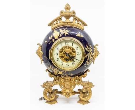 Mantel Clock with French movement. Blue enamelled surround with painted flowers. Eight-day movement, held on cast gildedbase.