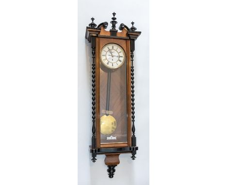 A good Vienna wall clock with single weight movement, two-piece enamel dial. Walnut veneered case with ebonised trim. Lovely 